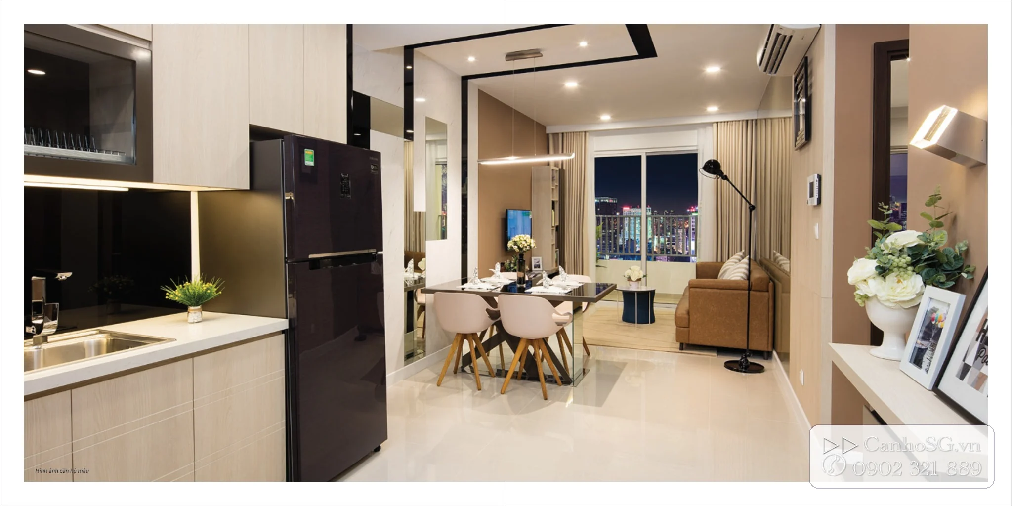 Không gian nội thất căn hộ The Park Avenue với khu bếp, bàn ăn, phòng khách và tầm nhìn thành phố về đêm.